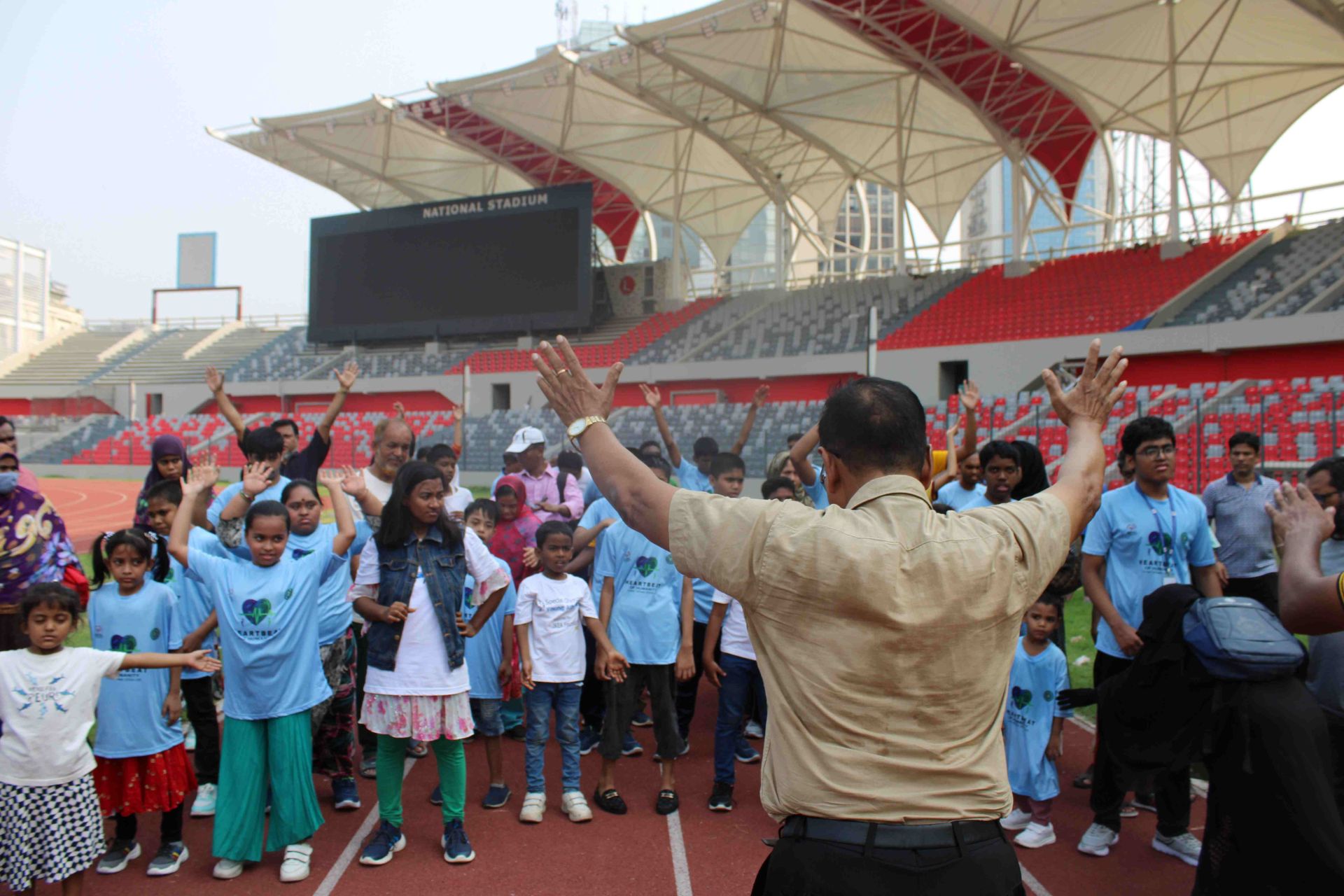 Special Olympics Bangladesh athletes training together on a field